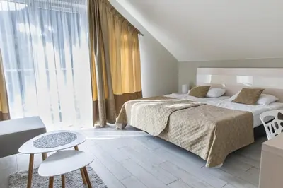 Łóżko lub łóżka w pokoju w obiekcie VacationClub - Ischgl Apartament 39
