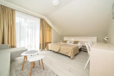Łóżko lub łóżka w pokoju w obiekcie VacationClub - Ischgl Apartament 39