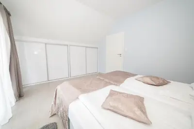 Łóżko lub łóżka w pokoju w obiekcie VacationClub - Livigno Apartament 37