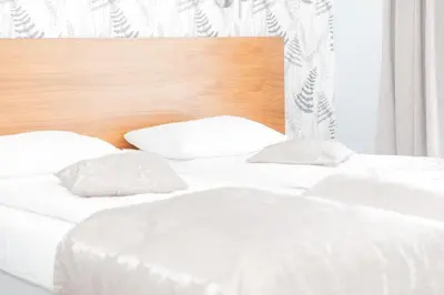 Łóżko lub łóżka w pokoju w obiekcie VacationClub - Livigno Apartament 37