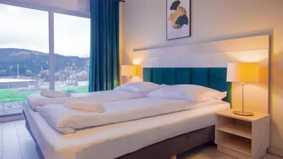Łóżko lub łóżka w pokoju w obiekcie VacationClub - Solden Apartament 3
