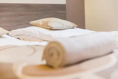 Łóżko lub łóżka w pokoju w obiekcie VacationClub - Tignes Apartament 31