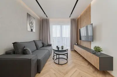 Telewizja i/lub zestaw kina domowego w obiekcie Exclusive Apartment with Balcony & Parking Wrocław by Renters Prestige