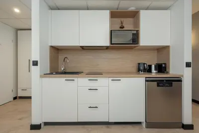 Kuchnia lub aneks kuchenny w obiekcie Wroclavia Apartments Dyrekcyjna by Noclegi Renters