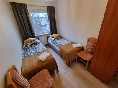 Łóżko lub łóżka w pokoju w obiekcie Apartament Olszewskiego