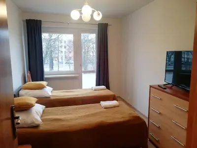 Łóżko lub łóżka w pokoju w obiekcie Apartament Olszewskiego
