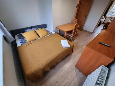 Łóżko lub łóżka w pokoju w obiekcie Apartament Olszewskiego