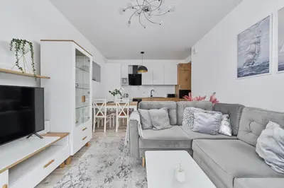 Część wypoczynkowa w obiekcie Spacious Apartment suitable for Remote Work with Balcony & Parking by Noclegi Renters