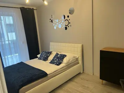 Łóżko lub łóżka w pokoju w obiekcie Apartament Korczak Park