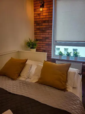Łóżko lub łóżka w pokoju w obiekcie Apartament Ceglany