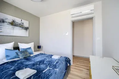 Łóżko lub łóżka w pokoju w obiekcie AboutArtApartments - Otyńska 4