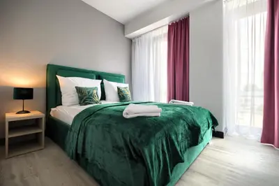 Łóżko lub łóżka w pokoju w obiekcie AboutArtApartments - Otyńska 4