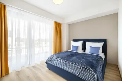 Łóżko lub łóżka w pokoju w obiekcie AboutArtApartments - Otyńska 4
