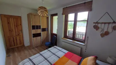 Łóżko lub łóżka w pokoju w obiekcie Apartament Międzygórski
