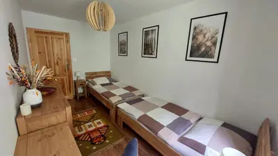 Łóżko lub łóżka w pokoju w obiekcie Apartament Międzygórski