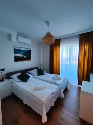 Łóżko lub łóżka w pokoju w obiekcie Apartament Miodowy - Penthouse z balkonem