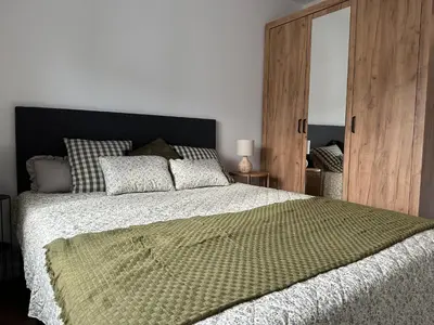 Łóżko lub łóżka w pokoju w obiekcie Apartament 28 w Dolinie Baryczy - 5D Apartamenty