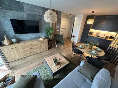 Telewizja i/lub zestaw kina domowego w obiekcie Apartament 28 w Dolinie Baryczy - 5D Apartamenty