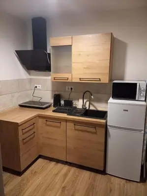 Kuchnia lub aneks kuchenny w obiekcie Przytulny Apartament z Balkonem