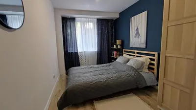 Łóżko lub łóżka w pokoju w obiekcie Apartament Opawska 16