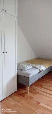 Łóżko lub łóżka w pokoju w obiekcie Apartment na Gruszy