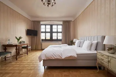 Łóżko lub łóżka w pokoju w obiekcie Boutique Pałac Warmątowice Sienkiewiczowskie