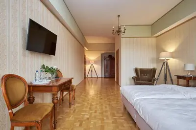 Łóżko lub łóżka w pokoju w obiekcie Boutique Pałac Warmątowice Sienkiewiczowskie