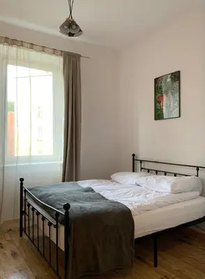 Łóżko lub łóżka w pokoju w obiekcie Śródmieście