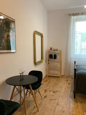 Łóżko lub łóżka w pokoju w obiekcie Śródmieście