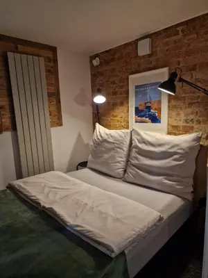 Łóżko lub łóżka w pokoju w obiekcie Apartment Emilia
