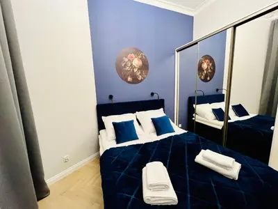 Łóżko lub łóżka w pokoju w obiekcie HO!HOUSE Bulwar Staromiejski
