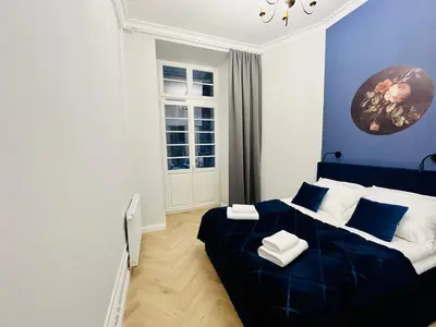 Łóżko lub łóżka w pokoju w obiekcie HO!HOUSE Bulwar Staromiejski