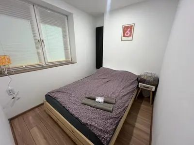 Łóżko lub łóżka w pokoju w obiekcie ApartamentsByMatyrafa-IV