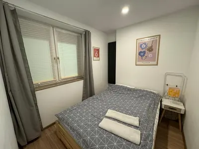 Łóżko lub łóżka w pokoju w obiekcie ApartamentsByMatyrafa-IV