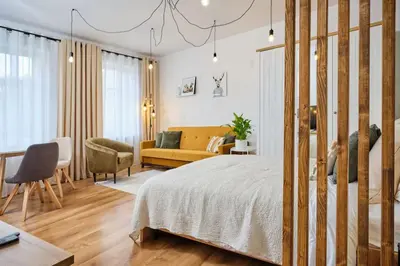 Łóżko lub łóżka w pokoju w obiekcie Jak w domu