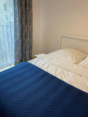 Łóżko lub łóżka w pokoju w obiekcie DAKOTA Easy Stay Center