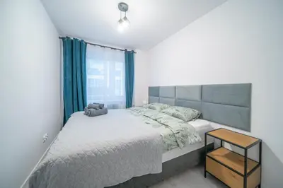 Łóżko lub łóżka w pokoju w obiekcie Stylowy apartament Blue self check in 24h