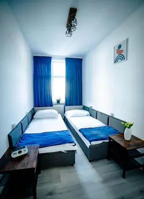Łóżko lub łóżka w pokoju w obiekcie LOFTY APARTAMENTY Namysłów I