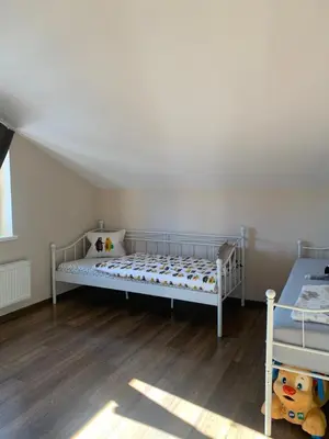 Łóżko lub łóżka w pokoju w obiekcie Apartament Bobrzańska - 4 bedrooms sypialnie