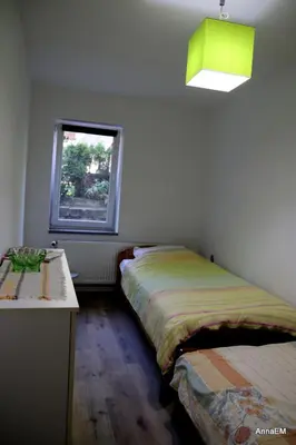 Łóżko lub łóżka w pokoju w obiekcie Apartament Anna