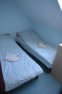 Łóżko lub łóżka w pokoju w obiekcie Lawendowa Przystań - Dolina Baryczy