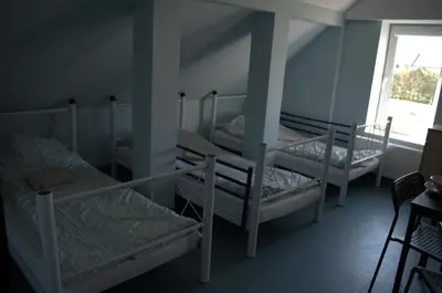Łóżko lub łóżka w pokoju w obiekcie Lawendowa Przystań - Dolina Baryczy