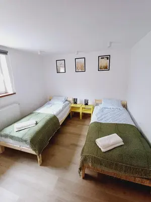 Łóżko lub łóżka w pokoju w obiekcie Apartament Jan