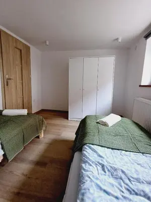 Łóżko lub łóżka w pokoju w obiekcie Apartament Jan