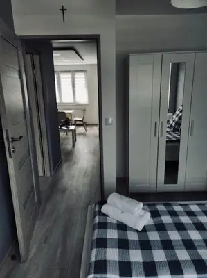 Łóżko lub łóżka w pokoju w obiekcie Apartament Poniatowskiego z parkingiem