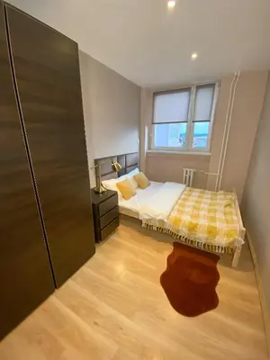 Łóżko lub łóżka w pokoju w obiekcie Apartament Panorama Centrum