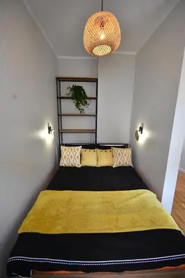 Łóżko lub łóżka w pokoju w obiekcie Apartamenty Basztowa