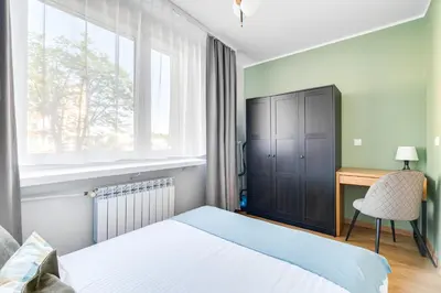 Łóżko lub łóżka w pokoju w obiekcie Apartament Pogodny, PW INVEST HOME