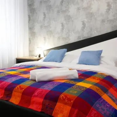 Łóżko lub łóżka w pokoju w obiekcie Apartament przy Palmiarni