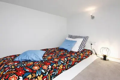 Łóżko lub łóżka w pokoju w obiekcie Apartament przy Palmiarni